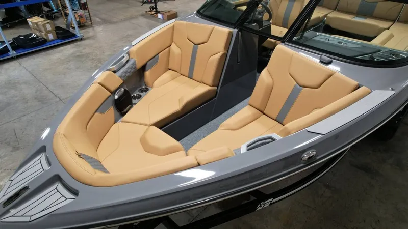 Slide: The Image of Interior of 2026 MasterCraft XT23 boat with beige seating. - 29