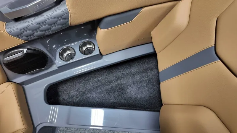 Slide: The Image of Interior of 2026 MasterCraft XT23 with cup holders and upholstery. - 31