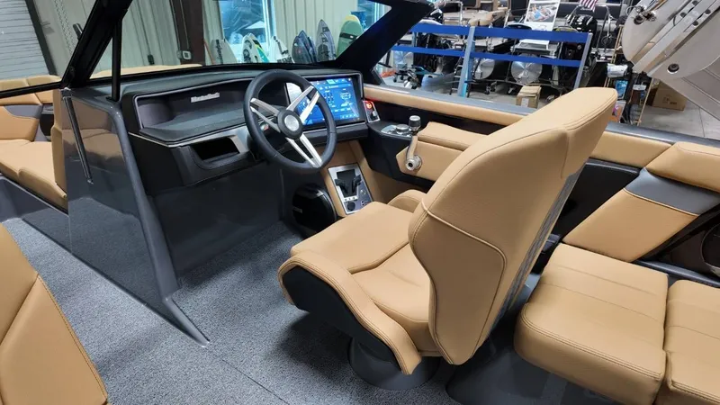 Slide: The Image of Interior of 2026 MasterCraft XT23 with modern steering wheel and touchscreen. - 34