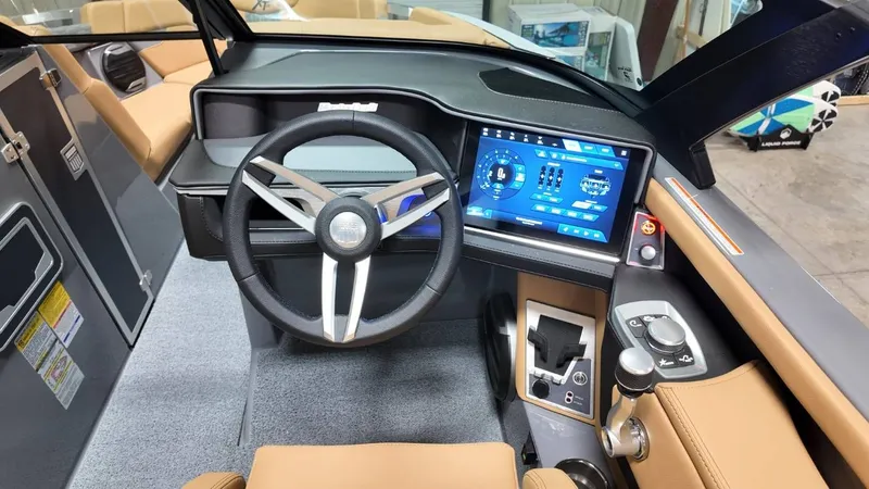 Slide: The Image of Interior of 2026 MasterCraft XT23 with modern dashboard and steering wheel. - 35