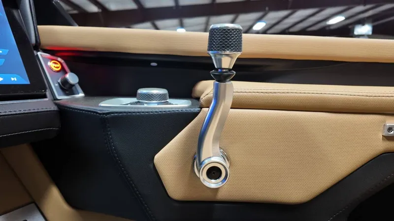 Slide: The Image of Interior of 2026 MasterCraft XT23 with gear lever and controls. - 39