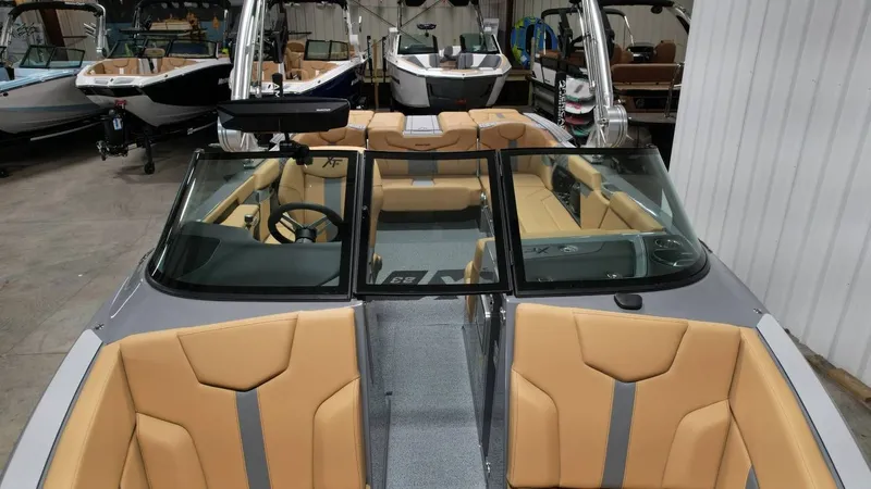 Slide: The Image of Interior view of 2026 MasterCraft XT23 boat with beige seats. - 43