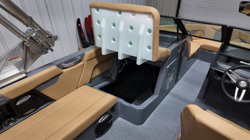 Slide: The Image of Interior of 2026 MasterCraft XT23 with beige seating and modern design. - 49