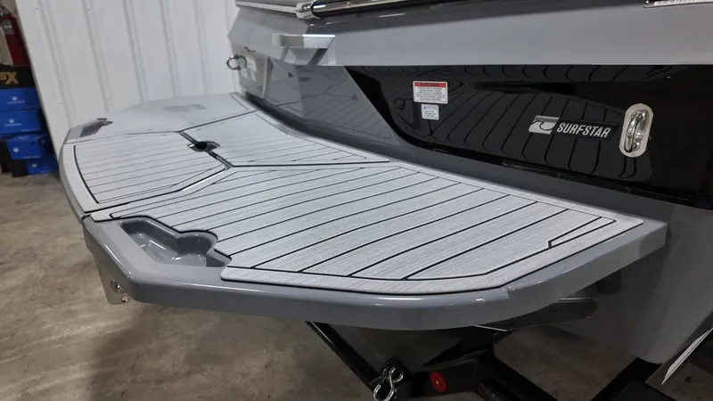 Slide: The Image of Rear view of 2026 MasterCraft XT23 with Surfstar logo. - 6