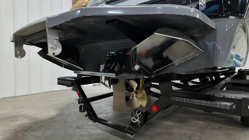 Slide: The Image of Rear view of a 2026 MasterCraft XT23 boat on a trailer. - 7