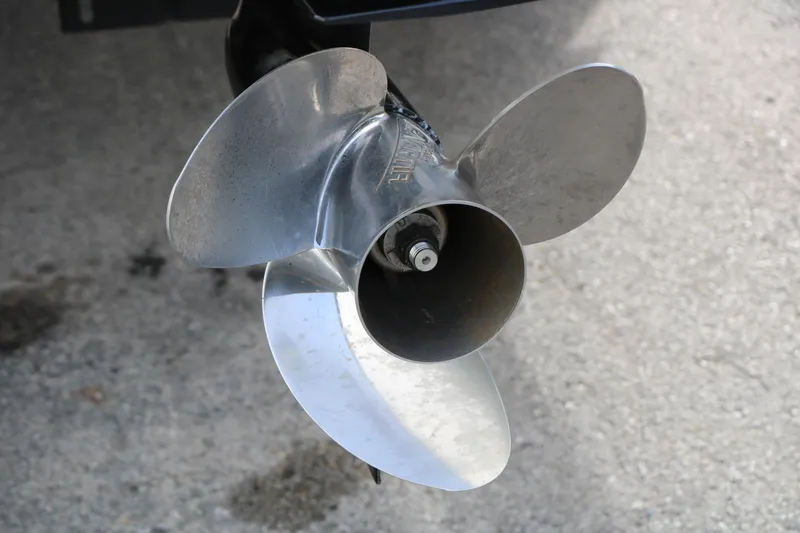 Slide: The Image of Close-up of a 2019 Crest II 240 SL boat propeller on concrete surface. - 17