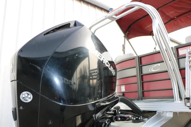 Slide: The Image of 2019 Crest II 240 SL pontoon boat with Mercury outboard motor, red and silver design. - 18