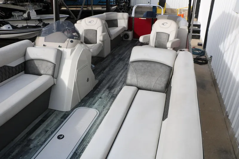 Slide: The Image of 2019 Crest II 240 SL pontoon boat with spacious seating and modern design. - 22
