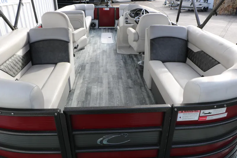 Slide: The Image of 2019 Crest II 240 SL pontoon boat interior with spacious seating and modern design. - 28