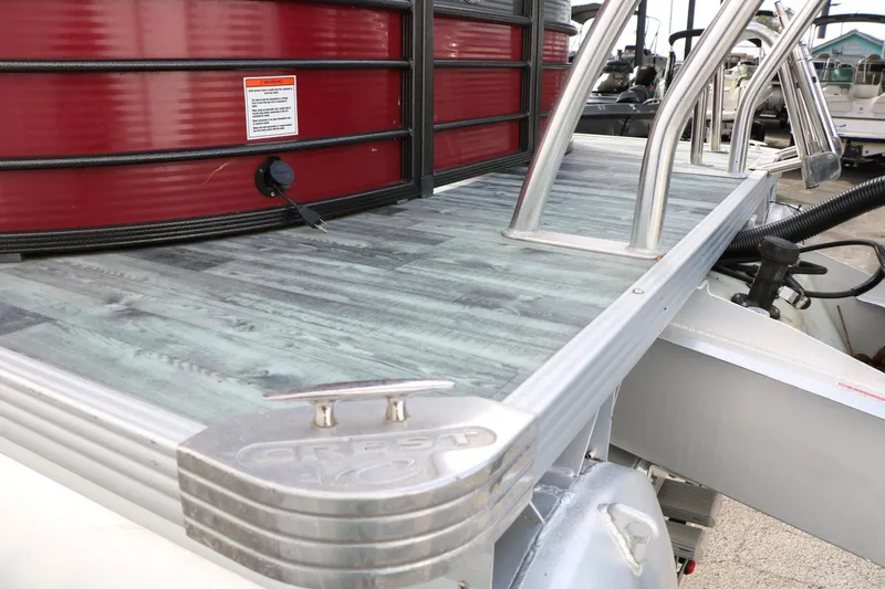 Slide: The Image of 2019 Crest II 240 SL pontoon boat with sleek deck and stainless steel railings. - 41