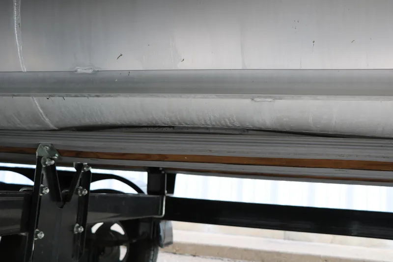 Slide: The Image of 2019 Crest II 240 SL pontoon boat underside with visible structural components. - 43