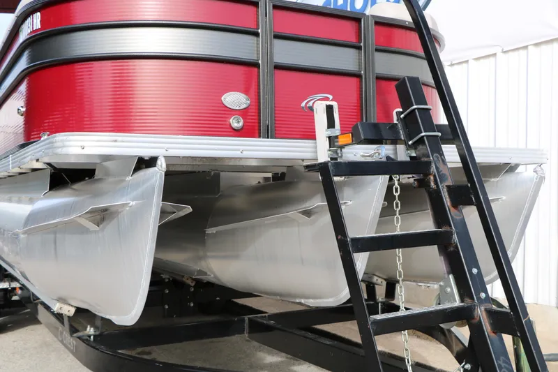 Slide: The Image of 2019 Crest II 240 SL pontoon boat with red exterior and ladder. - 9