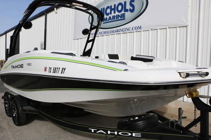 Slide: The Image of 2017 Tahoe 1950 boat on trailer at Nichols Marine dealership. - 13