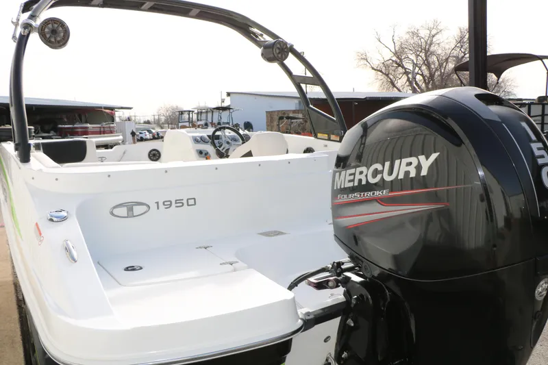 Slide: The Image of 2017 Tahoe 1950 boat with Mercury FourStroke engine, docked outdoors. - 14