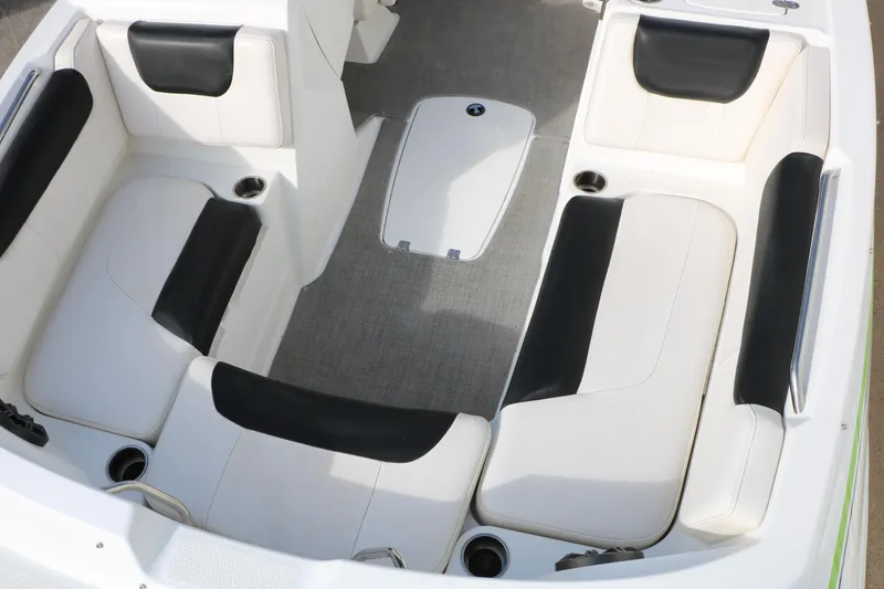 Slide: The Image of Interior seating of a 2017 Tahoe 1950 boat with black and white upholstery. - 24