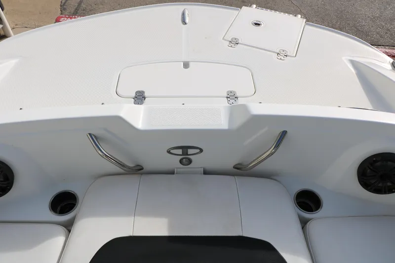 Slide: The Image of Rear view of a 2017 Tahoe 1950 boat deck with seating and storage compartments. - 33