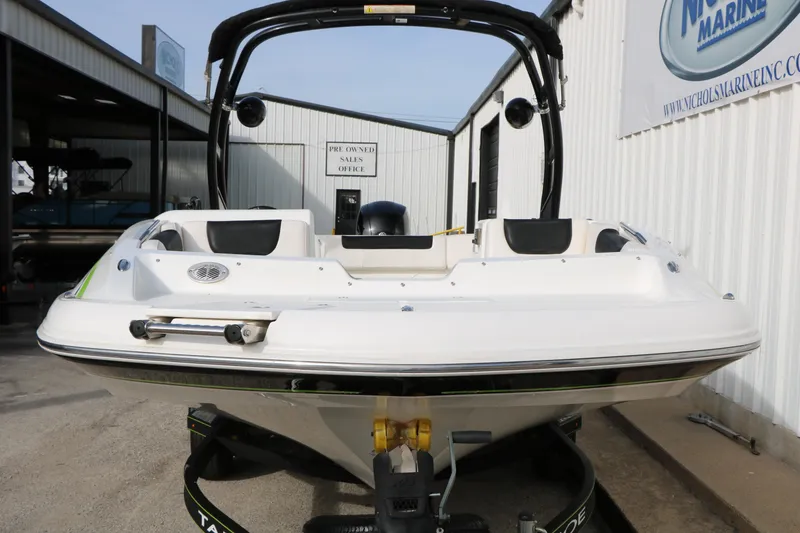 Slide: The Image of 2017 Tahoe 1950 boat on trailer at marine dealership. - 6