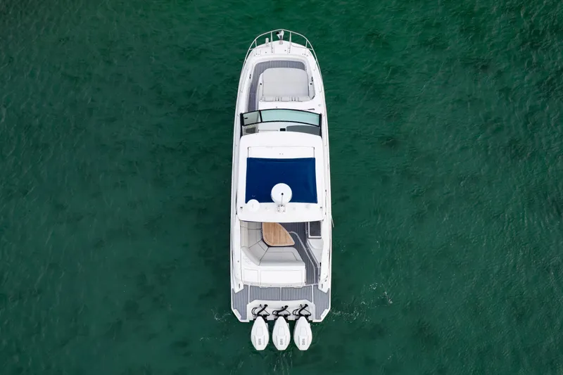 Slide: The Image of Top view of 2020 Sea Ray Sundancer 320 Outboard on clear green water. - 12