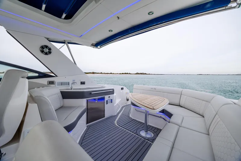 Slide: The Image of Luxurious 2020 Sea Ray Sundancer 320 Outboard interior with elegant seating and ocean view. - 23