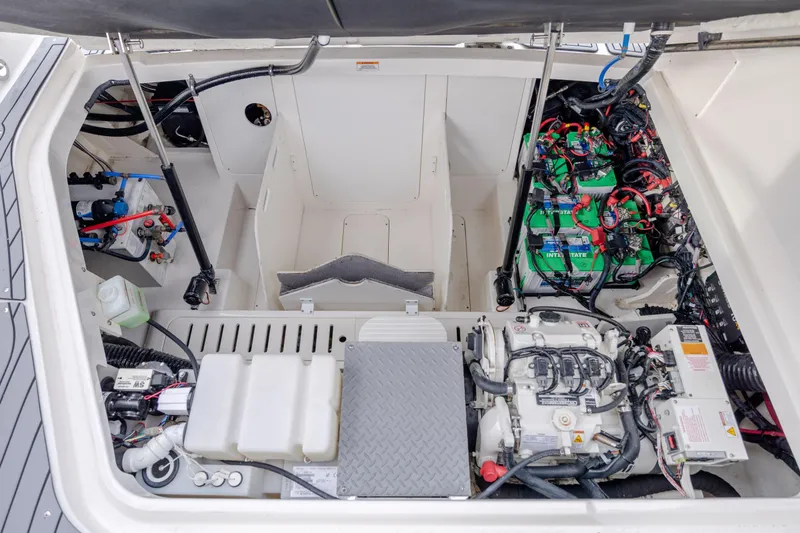 Slide: The Image of Engine compartment of 2020 Sea Ray Sundancer 320 Outboard with batteries and wiring. - 28
