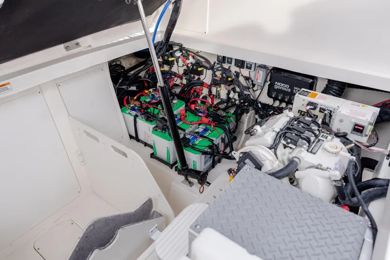 Slide: The Image of Engine compartment of 2020 Sea Ray Sundancer 320 Outboard with batteries and wiring. - 30
