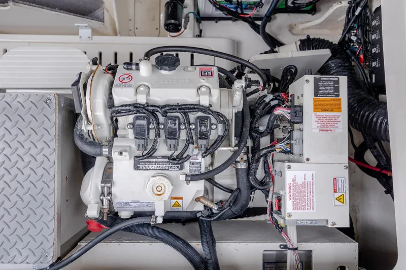 Slide: The Image of Engine compartment of 2020 Sea Ray Sundancer 320 Outboard with wiring and components visible. - 31