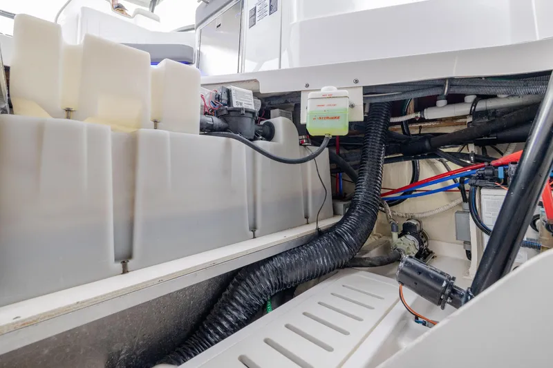 Slide: The Image of Engine compartment of 2020 Sea Ray Sundancer 320 Outboard, showcasing internal components and wiring. - 33