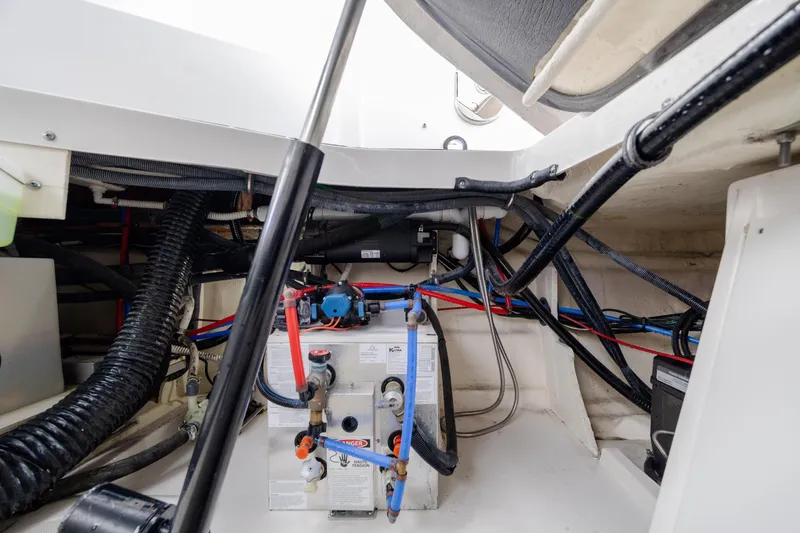 Slide: The Image of Engine compartment of 2020 Sea Ray Sundancer 320 Outboard with visible wiring and components. - 34