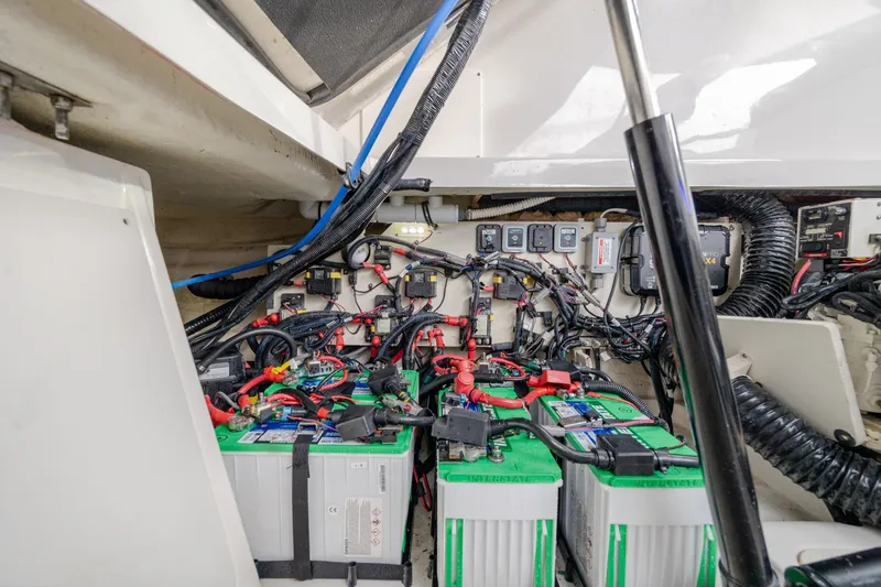 Slide: The Image of Engine compartment of 2020 Sea Ray Sundancer 320 Outboard with batteries and wiring. - 35