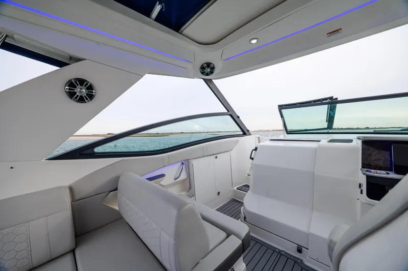 Slide: The Image of Interior of 2020 Sea Ray Sundancer 320 Outboard, featuring modern seating and sleek design. - 45