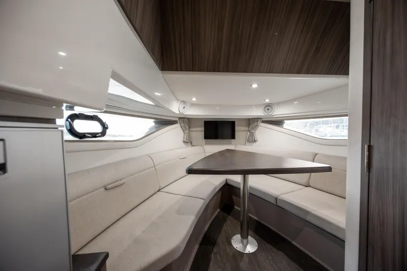 Slide: The Image of 2020 Sea Ray Sundancer 320 Outboard interior with cozy seating and modern design. - 46