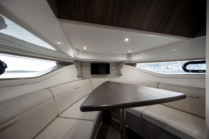 Slide: The Image of Luxurious interior of 2020 Sea Ray Sundancer 320 Outboard with elegant seating and table. - 47