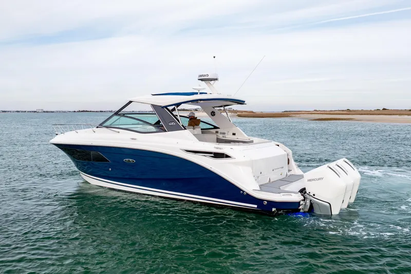 Slide: The Image of 2020 Sea Ray Sundancer 320 Outboard cruising on open water. - 5