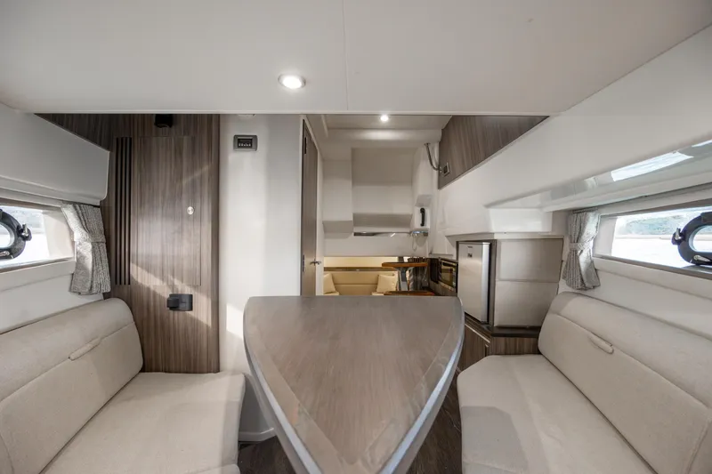 Slide: The Image of Interior of 2020 Sea Ray Sundancer 320 Outboard, featuring elegant seating and modern design. - 50