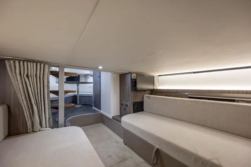 Slide: The Image of Interior of 2020 Sea Ray Sundancer 320 Outboard, featuring cozy seating and modern design. - 59