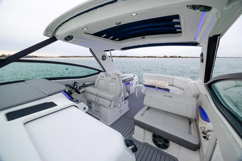 Slide: The Image of 2020 Sea Ray Sundancer 320 Outboard interior with luxurious seating and open water view. - 62