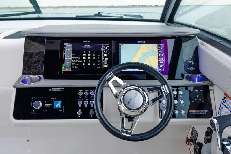 Slide: The Image of 2020 Sea Ray Sundancer 320 Outboard helm with advanced navigation and control systems. - 66
