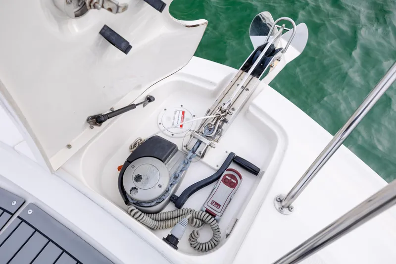 Slide: The Image of 2020 Sea Ray Sundancer 320 Outboard anchor compartment with winch and control panel. - 68