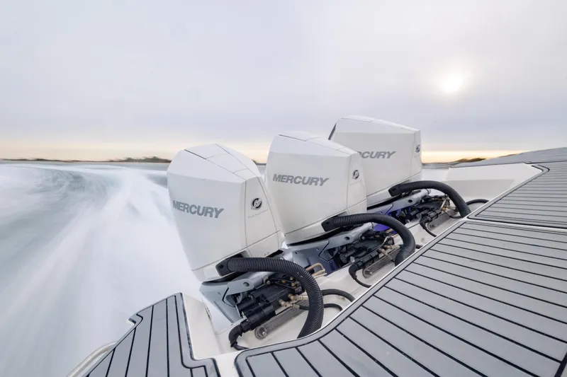 Slide: The Image of 2020 Sea Ray Sundancer 320 Outboard with triple Mercury engines on water. - 73