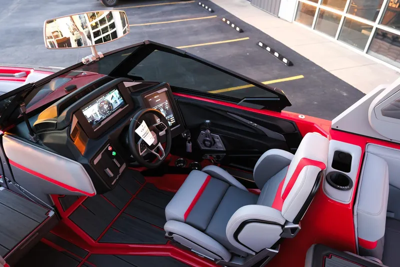 Slide: The Image of 2025 Supra SE boat interior with modern dashboard and red-accented seating. - 19
