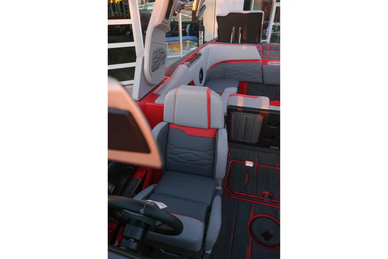 Slide: The Image of 2025 Supra SE boat interior with gray and red seating, modern design. - 21