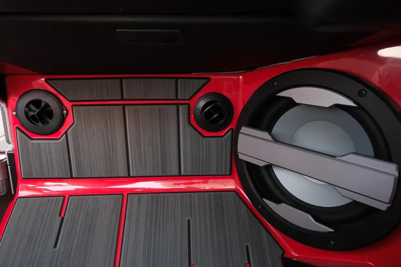 Slide: The Image of 2025 Supra SE interior with advanced audio system and sleek red accents. - 22