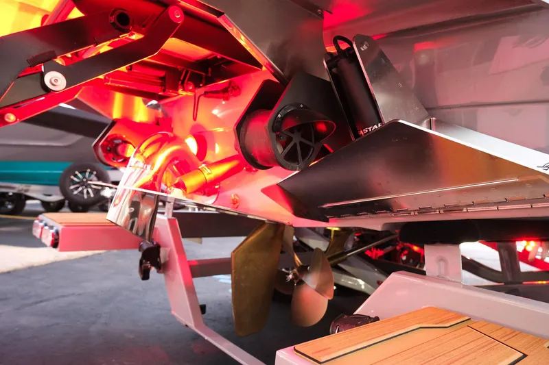 Slide: The Image of 2025 Supra SE boat with illuminated rear view, showcasing propeller and advanced design features. - 4