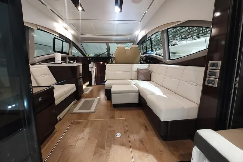 Slide: The Image of Luxurious interior of 2017 Sea Ray Sundancer 400 yacht with elegant seating and wood flooring. - 11
