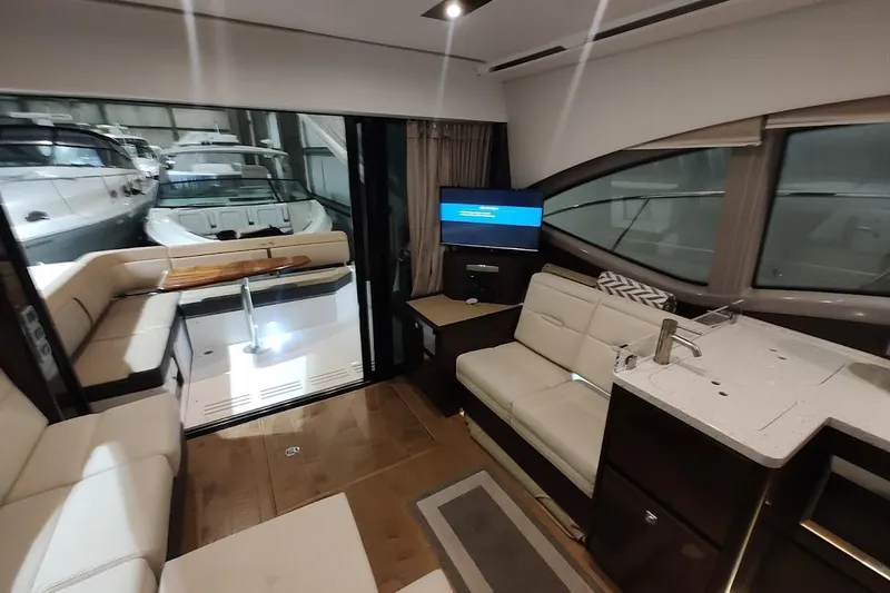 Slide: The Image of Luxurious interior of 2017 Sea Ray Sundancer 400 yacht with modern seating and kitchenette. - 13
