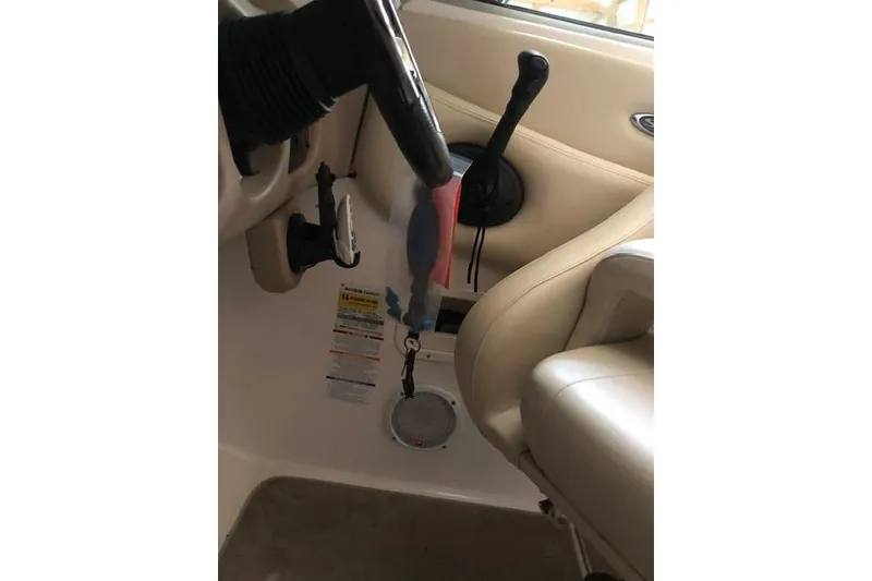 Slide: The Image of 2003 Chaparral Signature 260 boat interior with steering and controls. - 16