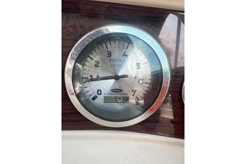 Slide: The Image of Close-up of 2003 Chaparral Signature 260 RPM gauge displaying 543.8 hours. - 18
