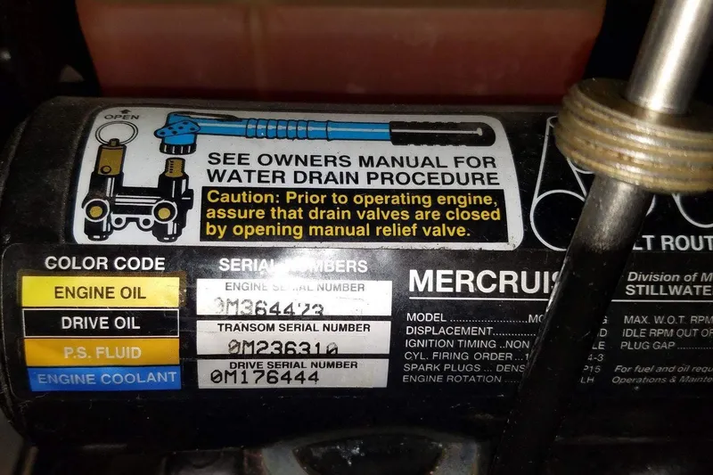 Slide: The Image of 2003 Chaparral Signature 260 engine label with water drain procedure and serial numbers. - 27