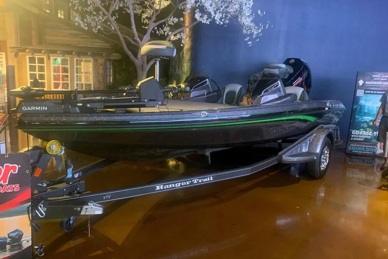 Slide: The Image of 2026 Ranger Z518 boat on display with Garmin equipment and Ranger Trail trailer. - 0