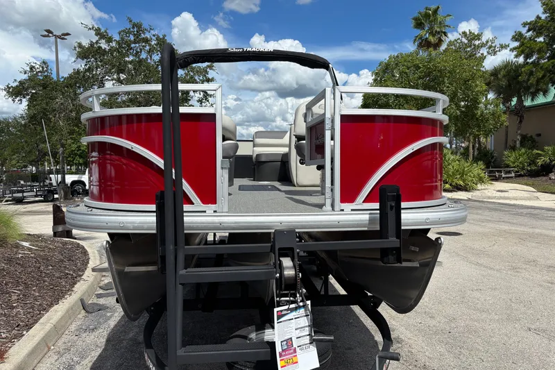 Slide: The Image of 2026 Sun Tracker Fishin' Barge 22 XP3 pontoon boat with vibrant red exterior. - 107